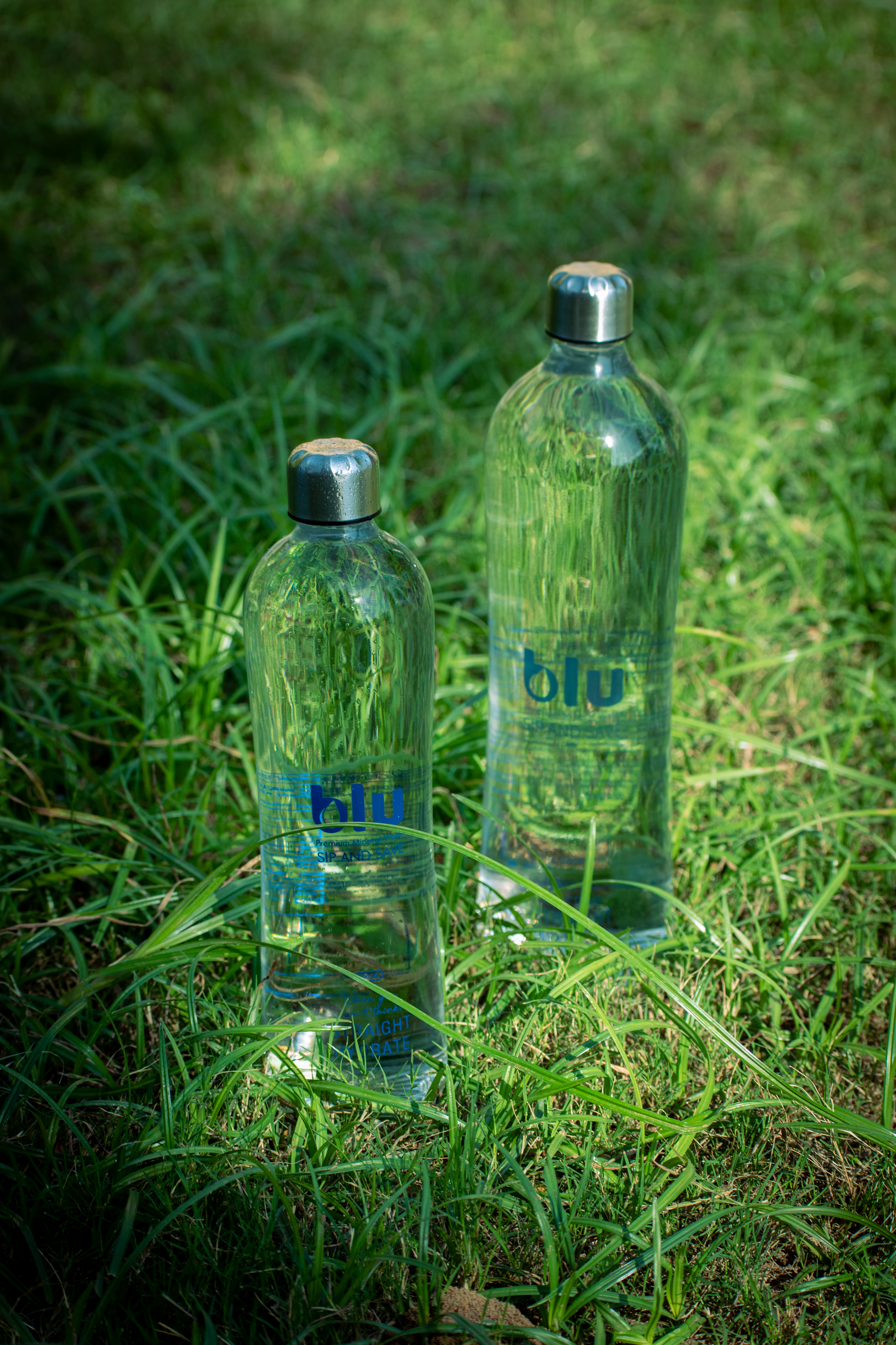 Blu Premium 500ml and 750ml bottles in nature